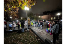 Hannah Pelphrey gives a speech to participants of the Take Back the Night March in front of the fountain by Stevenson Hall.